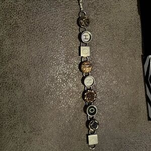 Recycled bracelet made from typewriter keys says honor